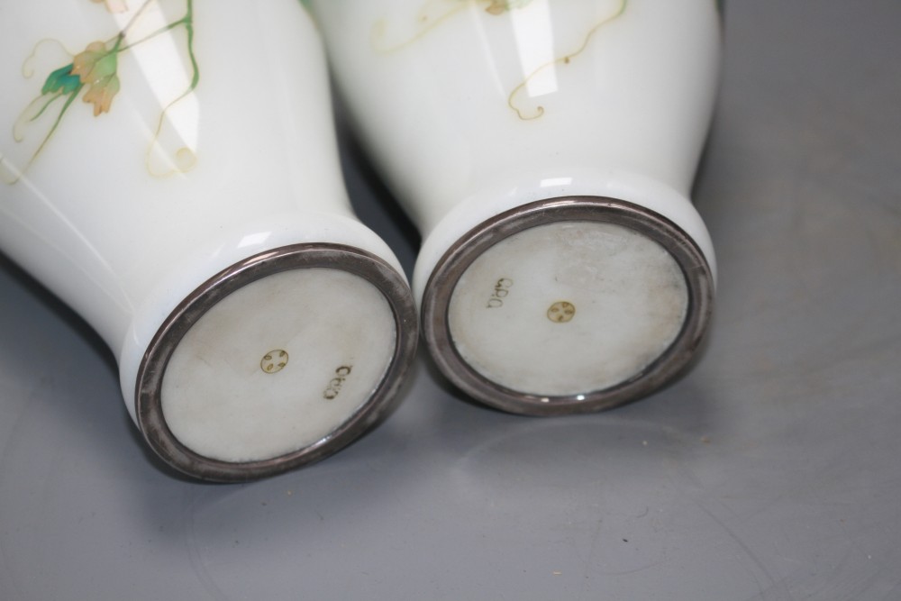A pair of Japanese cloisonne silver wire vases, decorated with grapes on a white ground, height 18.5cm